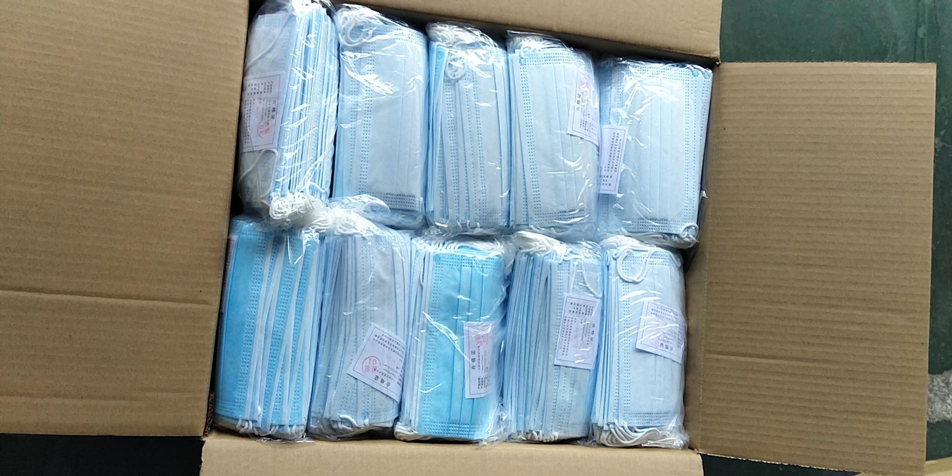 防疫物資出口，防護(hù)口罩出口人工檢驗(yàn)放行現(xiàn)場(chǎng)圖；東勝物流